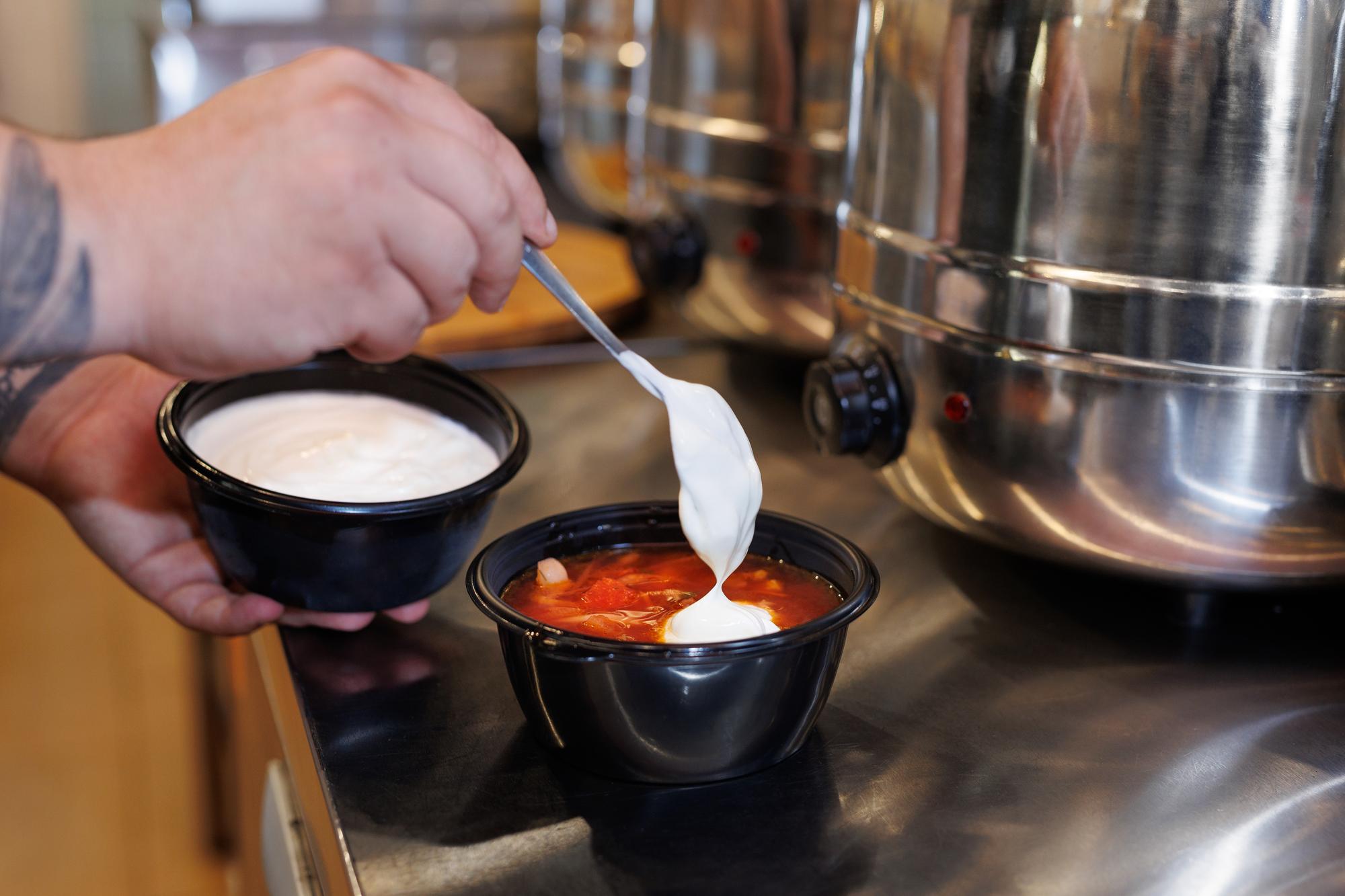 Instructor demonstrating sauce finish